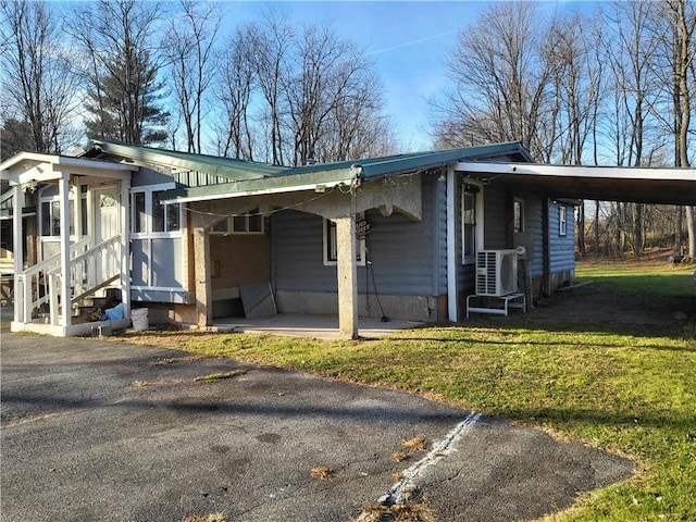 view of property exterior with a carport