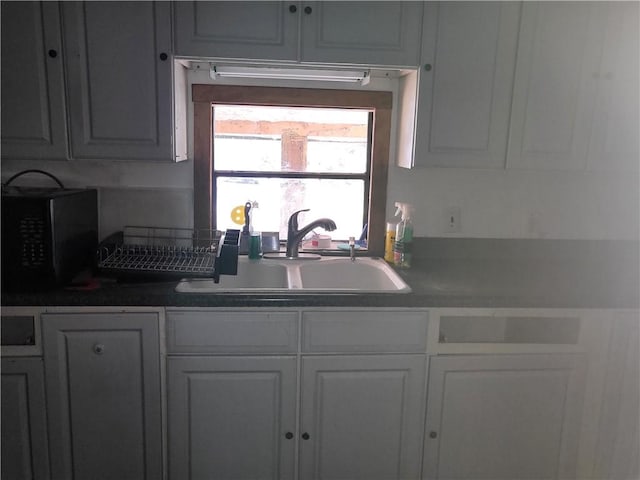 kitchen with white cabinets and sink