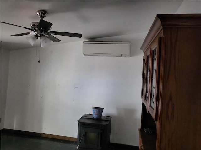 interior space with ceiling fan and a wall unit AC