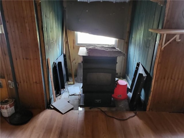 miscellaneous room featuring hardwood / wood-style flooring and wooden walls