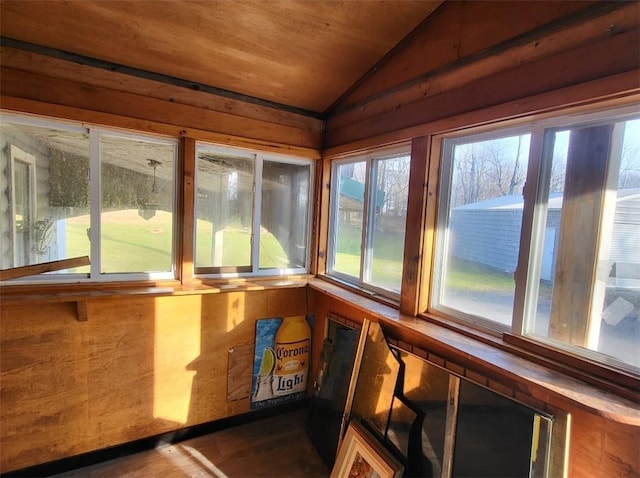 unfurnished sunroom with wooden ceiling and vaulted ceiling