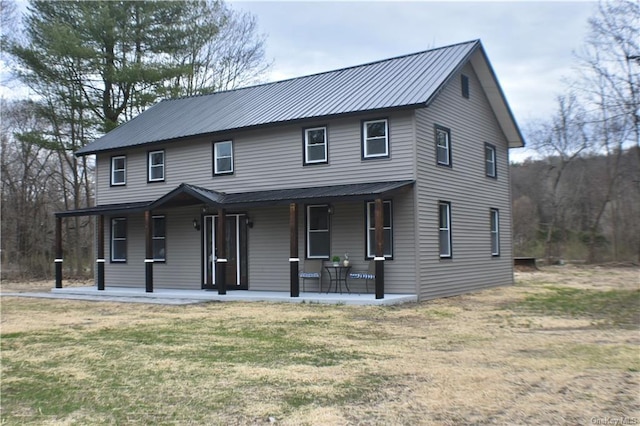 view of front of house featuring a porch and a front lawn