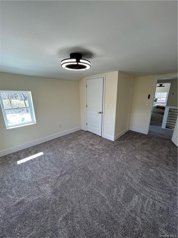 7065 Rte 209, Kerhonkson, NY 12446 - carpeted empty room featuring baseboards