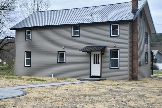 7065 Rte 209, Kerhonkson, NY 12446 - rear view of house with metal roof and a chimney