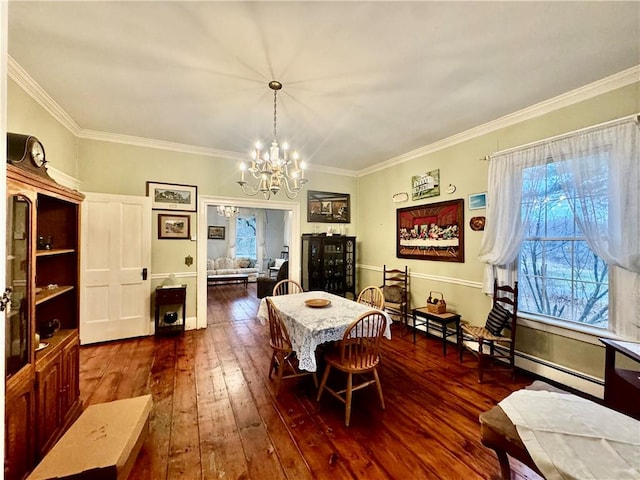 dining area with an inviting chandelier, baseboard heating, dark wood-type flooring, and crown molding