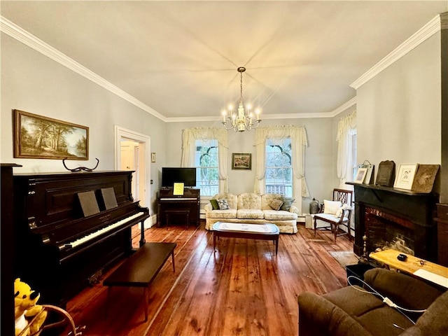 living room featuring crown molding, wood-type flooring, and a notable chandelier