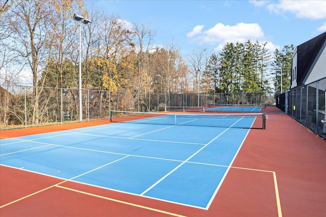 view of sport court with basketball hoop