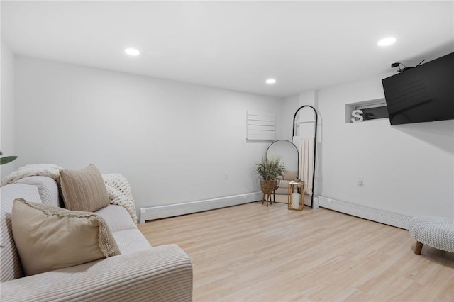 sitting room with light hardwood / wood-style floors and baseboard heating