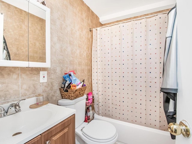 full bathroom featuring shower / bath combo, vanity, toilet, and tile walls