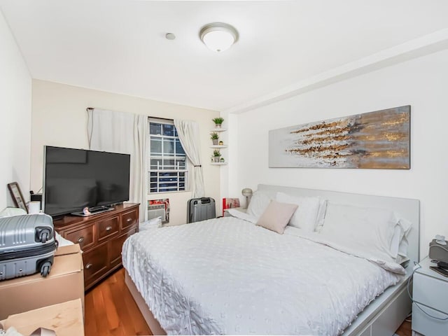 bedroom featuring wood-type flooring