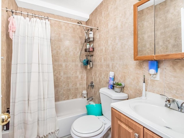 full bathroom featuring vanity, toilet, shower / bath combo with shower curtain, tile walls, and tasteful backsplash