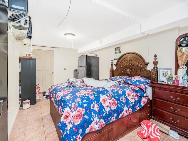 bedroom with stainless steel fridge and light tile patterned flooring