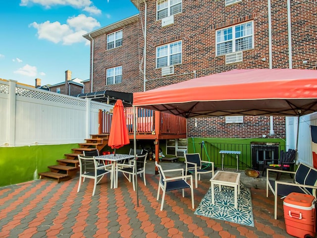 view of patio / terrace featuring a gazebo and a wooden deck