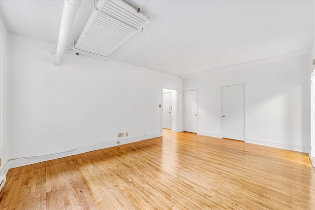 spare room featuring hardwood / wood-style flooring