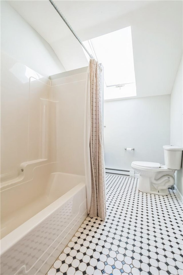 bathroom featuring shower / bath combo, toilet, and a baseboard radiator