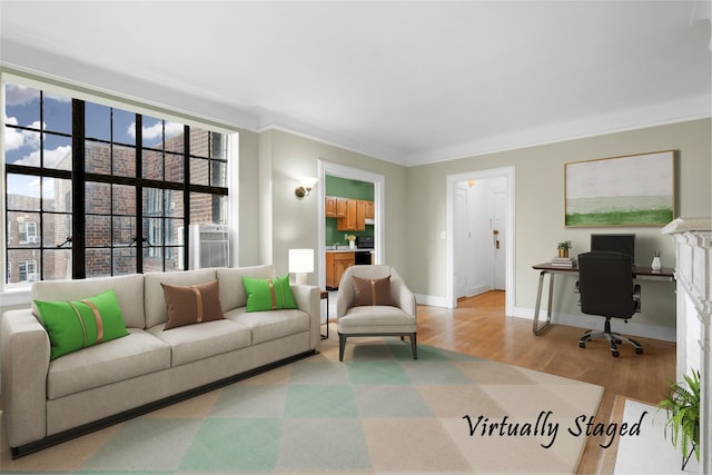 living room featuring plenty of natural light, light wood-type flooring, and ornamental molding