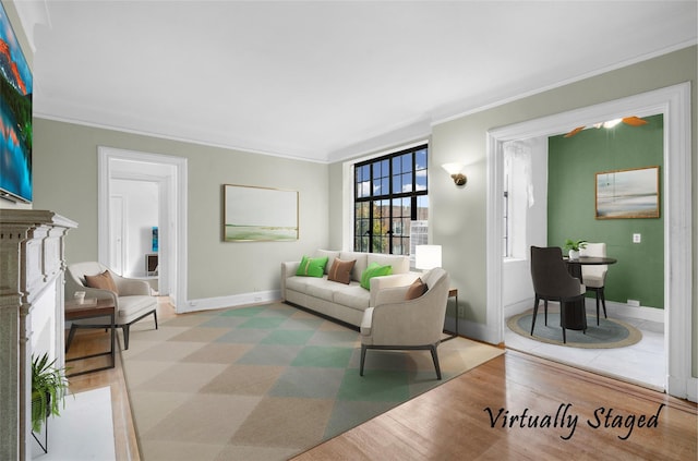 living room featuring ornamental molding and light wood-type flooring