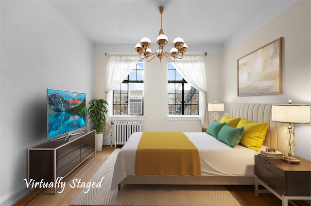 bedroom featuring radiator, a chandelier, and hardwood / wood-style flooring