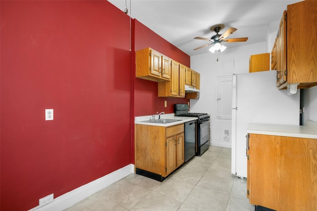 kitchen featuring black appliances, ceiling fan, light tile patterned floors, and sink