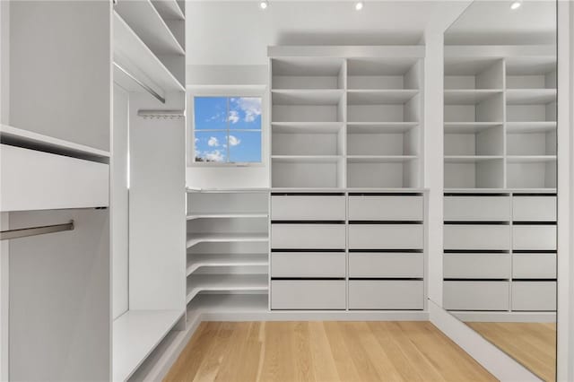 walk in closet featuring light hardwood / wood-style floors