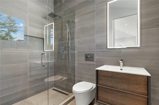 bathroom featuring walk in shower, vanity, toilet, and tile walls