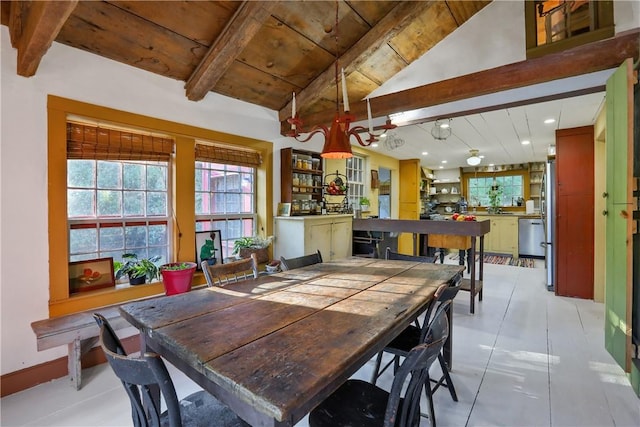 dining space with vaulted ceiling with beams and light tile patterned floors