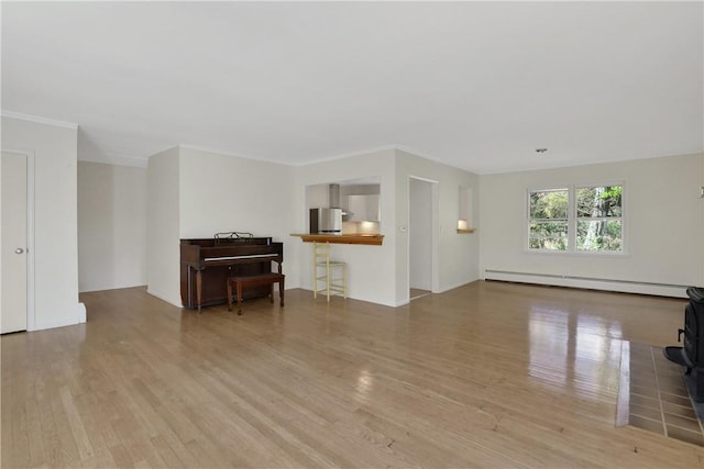 living room featuring crown molding, light hardwood / wood-style flooring, and a baseboard radiator