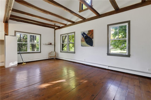 spare room featuring beamed ceiling, dark hardwood / wood-style floors, baseboard heating, and plenty of natural light