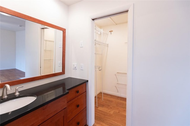 bathroom with vanity and hardwood / wood-style flooring