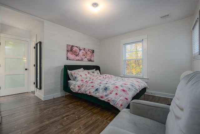 bedroom featuring dark wood-type flooring