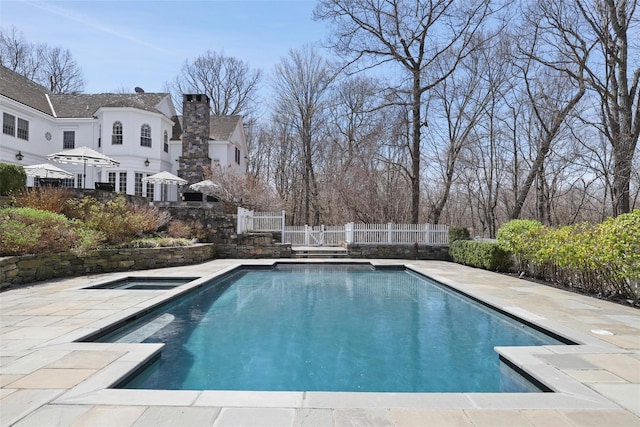 view of swimming pool with a fenced in pool, a patio area, and a fenced backyard