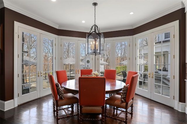 dining space featuring french doors, recessed lighting, a notable chandelier, and dark wood-style flooring