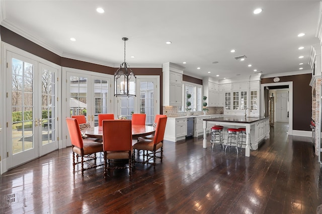 dining room featuring french doors, dark wood-style floors, recessed lighting, and crown molding