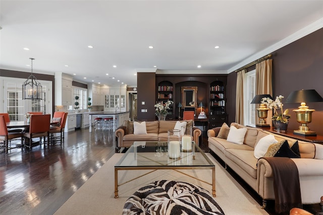 living room with dark wood-style floors, recessed lighting, and ornamental molding