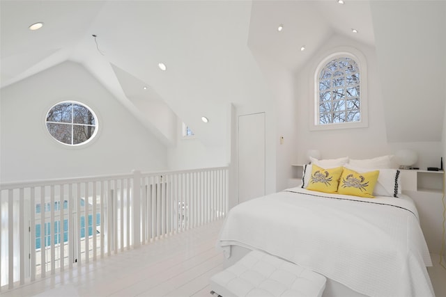 bedroom with recessed lighting and high vaulted ceiling