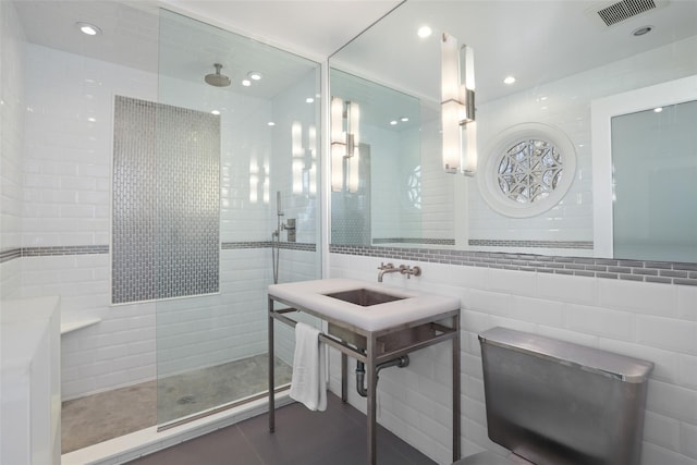 bathroom with recessed lighting, tile patterned flooring, visible vents, tile walls, and walk in shower
