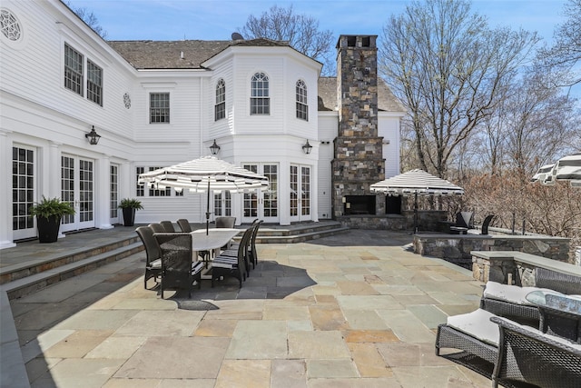 view of patio featuring french doors and outdoor dining area
