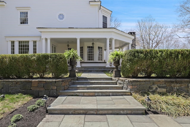 entrance to property featuring covered porch