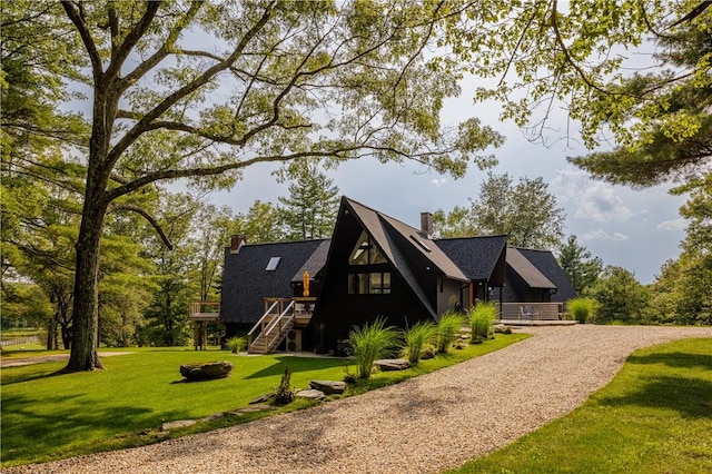 exterior space featuring a front yard and a deck