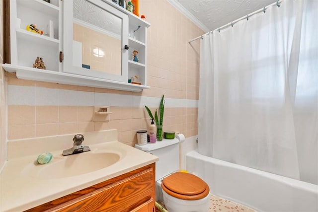 full bathroom with crown molding, shower / bath combination with curtain, toilet, vanity, and tile walls