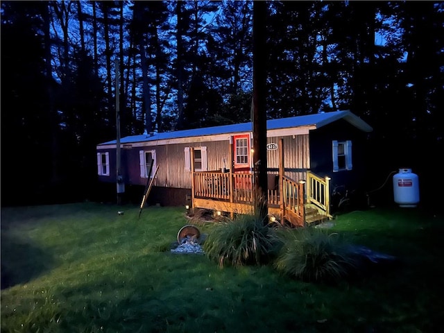 view of front of home with a yard