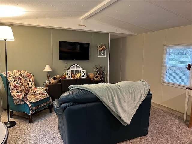 carpeted living room featuring vaulted ceiling with beams