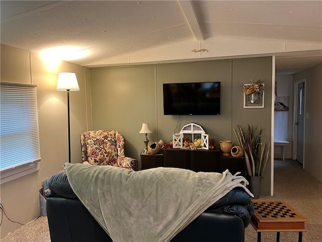 carpeted living room featuring lofted ceiling with beams