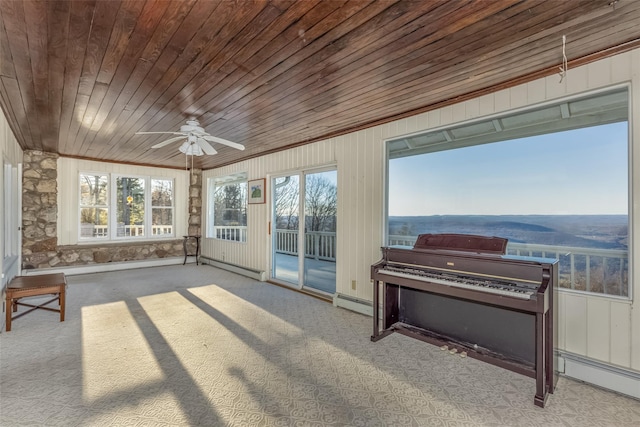 sunroom / solarium featuring baseboard heating, wooden ceiling, and ceiling fan