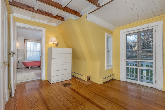 bonus room featuring a baseboard radiator, light hardwood / wood-style flooring, a wealth of natural light, and wooden ceiling