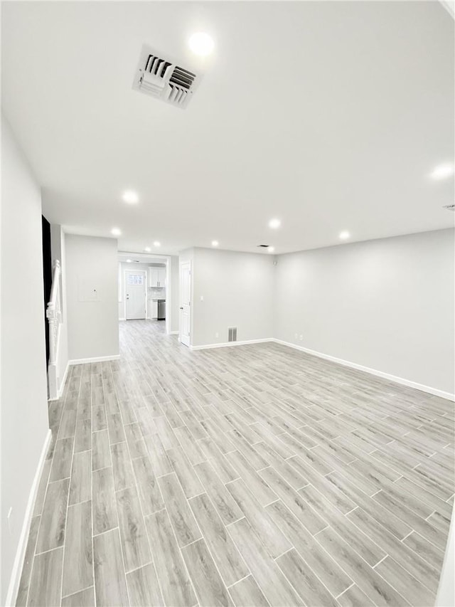 unfurnished living room featuring light hardwood / wood-style flooring