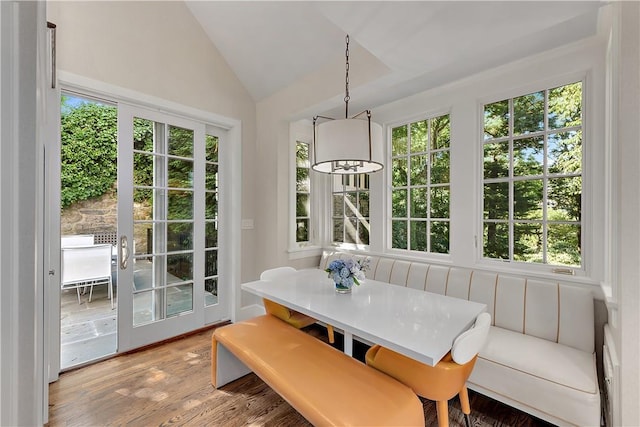 sunroom with lofted ceiling and breakfast area