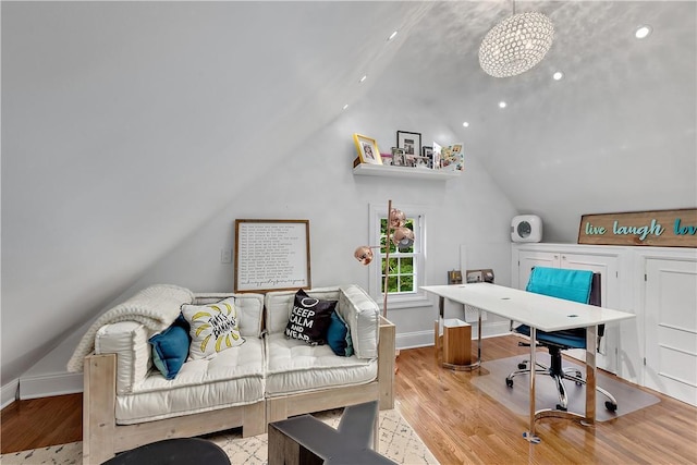 office area featuring vaulted ceiling and light hardwood / wood-style flooring