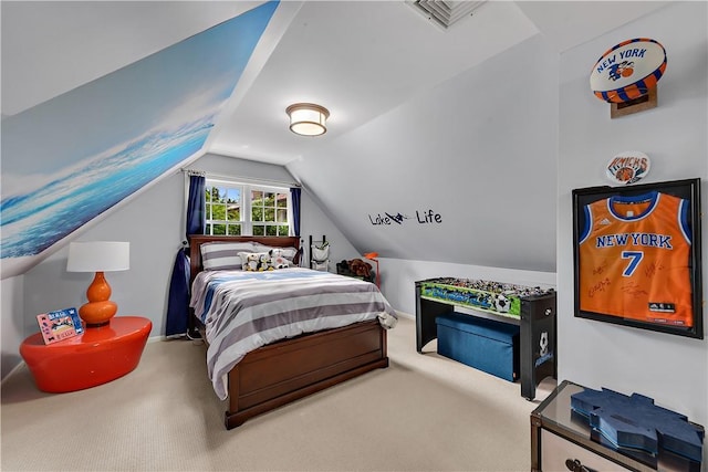 carpeted bedroom with lofted ceiling