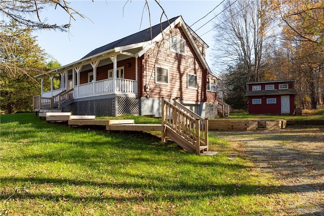 exterior space with a front yard, a porch, and an outdoor structure